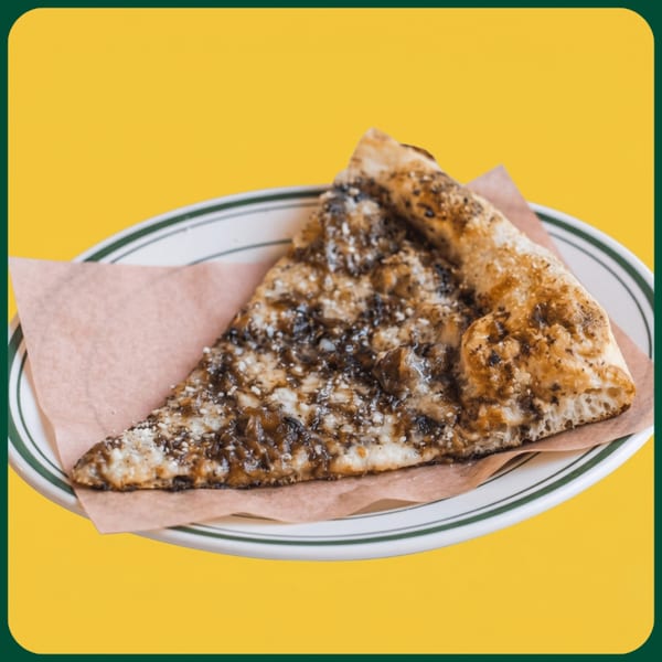 A single slice of pizza with caramelized onions and cheese on a white plate with green stripes.